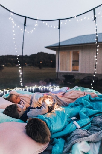 A backyard camping trampoline sleepover is the perfect way to spend a summer night with friends!