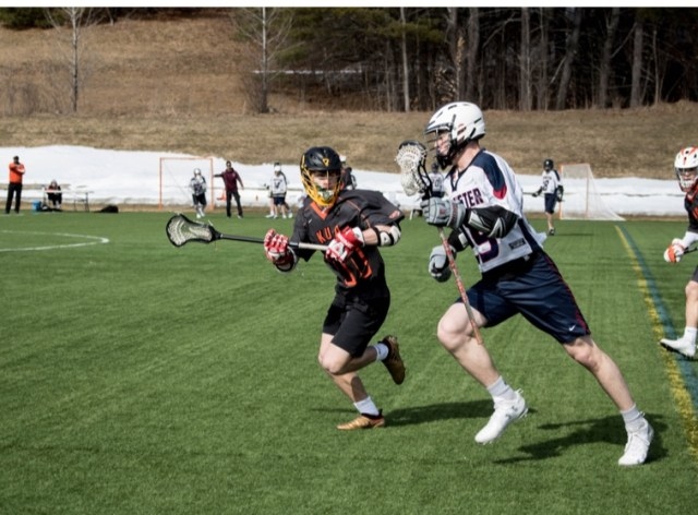 A high school lacrosse game has four 12-minute quarters with a 2-minute break between the first and second quarters and a 5-minute break between the third and fourth quarters.