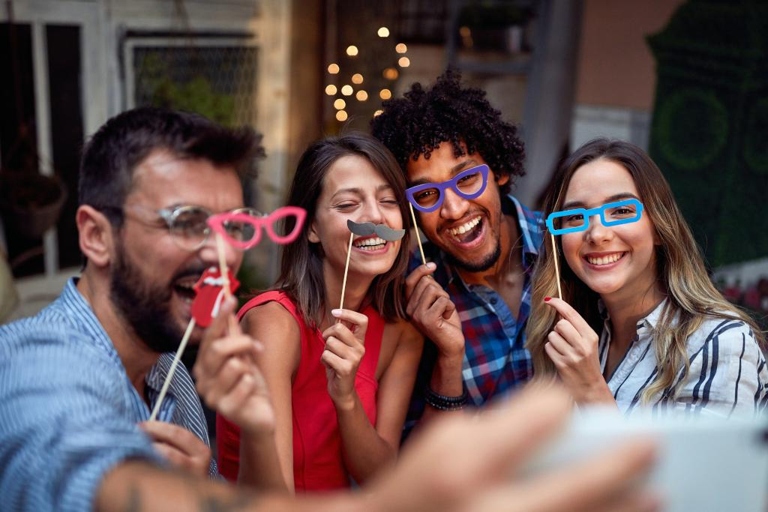 A selfie scavenger hunt is a fun party game for teenagers that encourages them to take photos of themselves with various objects and people.