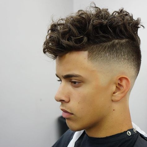 If you have curly hair and are looking for a new hairstyle, check out these teenage boy haircuts for curly hair.