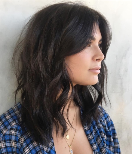 Middle part curtain bangs are a great way to add a bit of drama to your look without going too over the top.