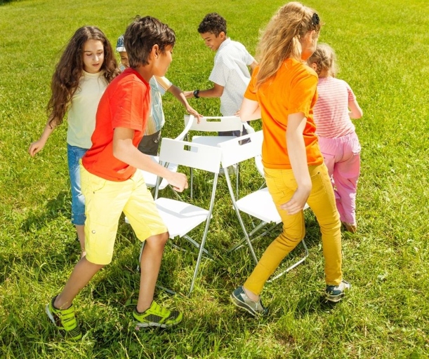 Musical chairs is a classic party game that can be enjoyed by teenagers.