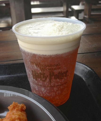 No, Hermione does not get drunk off of Butterbeer in the books, movies, or in Universal Studios.