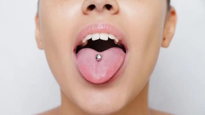 The age requirement for getting a tongue piercing varies by state, but is generally 18 years old.