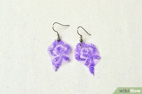 You can make homemade earrings out of many different materials, including paper, fabric, and metal.